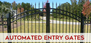 Automated residential entry gate on a paved driveway
