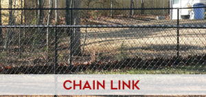 Residential galvanized chain link fence installed around a property perimeter