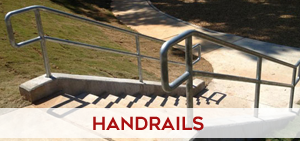 ADA-compliant commercial handrails and guardrails along concrete steps at a public building